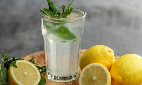 lime juice on drinking glass beside sliced limes