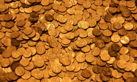 brown round coins on brown wooden surface