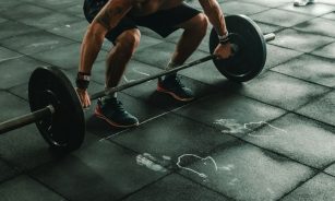man holding dumbbells