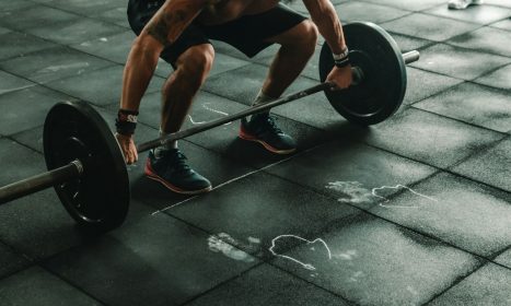 man holding dumbbells