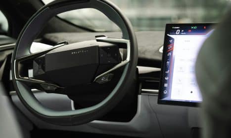 a car dashboard with an electronic device in the center