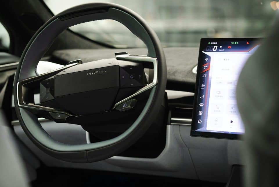 a car dashboard with an electronic device in the center