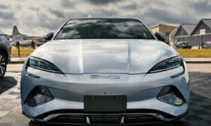 A silver sports car parked in a parking lot