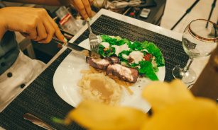 person slicing the dish photography