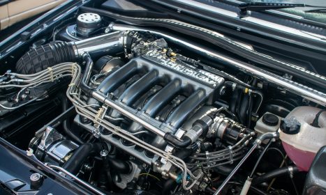 The engine compartment of a car with the hood up