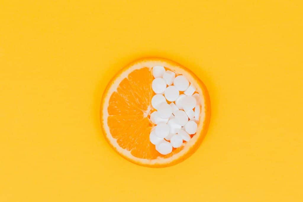 orange fruit slices on yellow surface