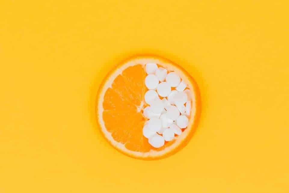 orange fruit slices on yellow surface