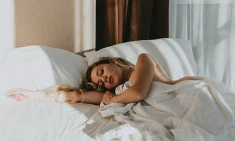 a woman lying on a bed