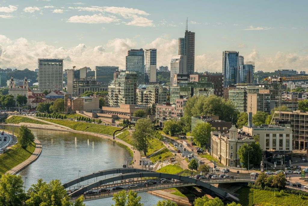 a river with a bridge and buildings