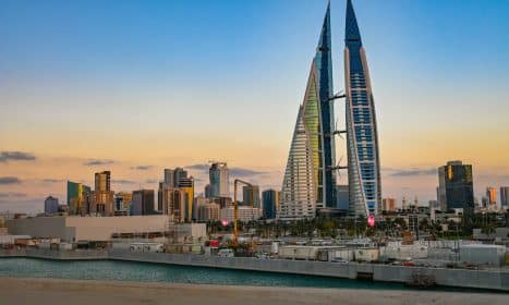 The bahrain world trade center at sunrise.