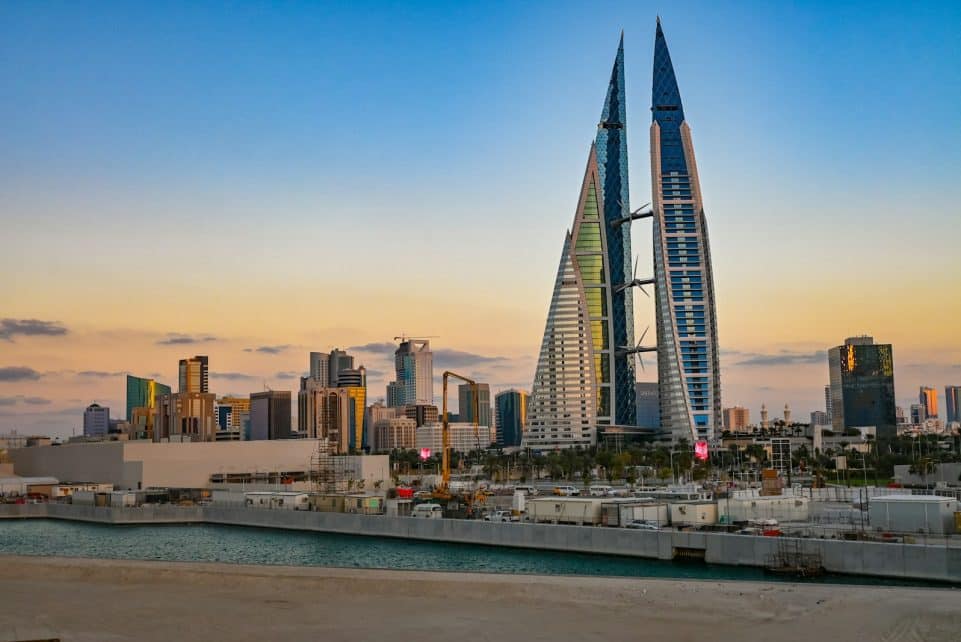 The bahrain world trade center at sunrise.
