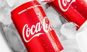 coca cola can on white plastic pack