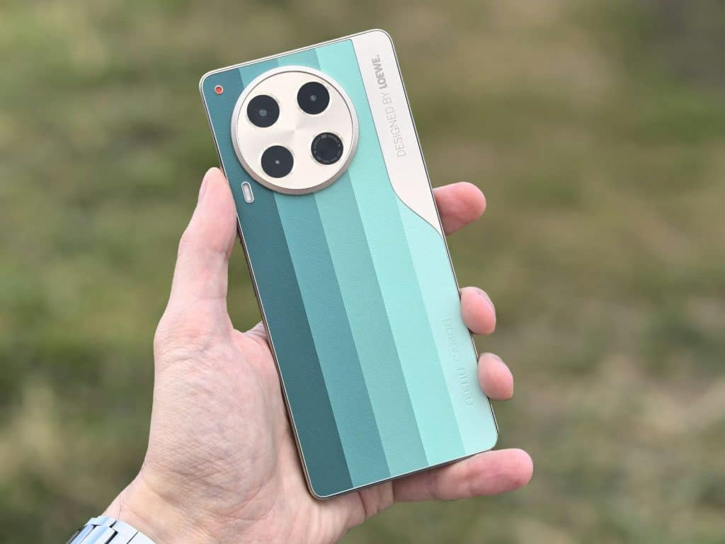 A person holding a cell phone in their hand