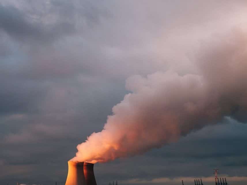sea waves crashing on shore under white clouds