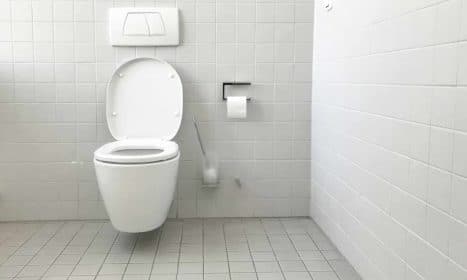 white toilet bowl with cistern