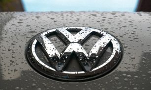 water dew on silver Volkswagen car emblem