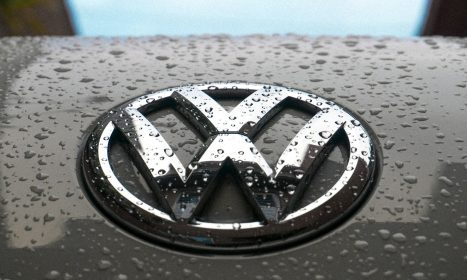 water dew on silver Volkswagen car emblem