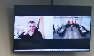 Nuotolinis teismo posėdis Kauno apygardos teisme dėl terminuotos laisvės atėmimo bausmės skyrimo Henrikui Daktarui. ELTA