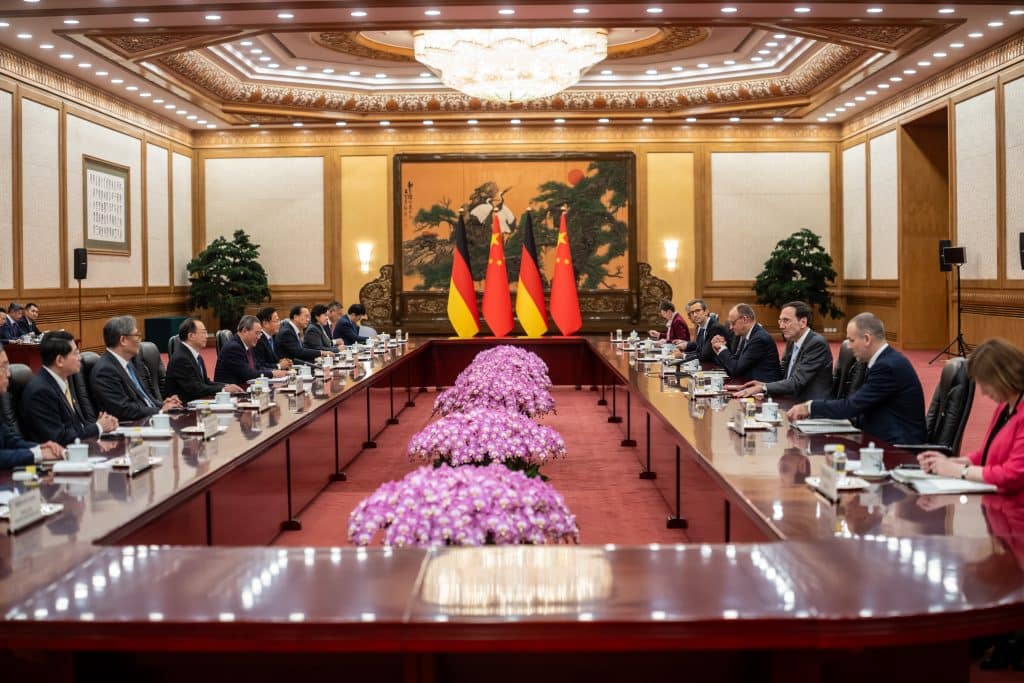 Vokietijos kancleris atvyko į Kiniją derybų dėl prekybos ir saugumo. EPA-ELTA