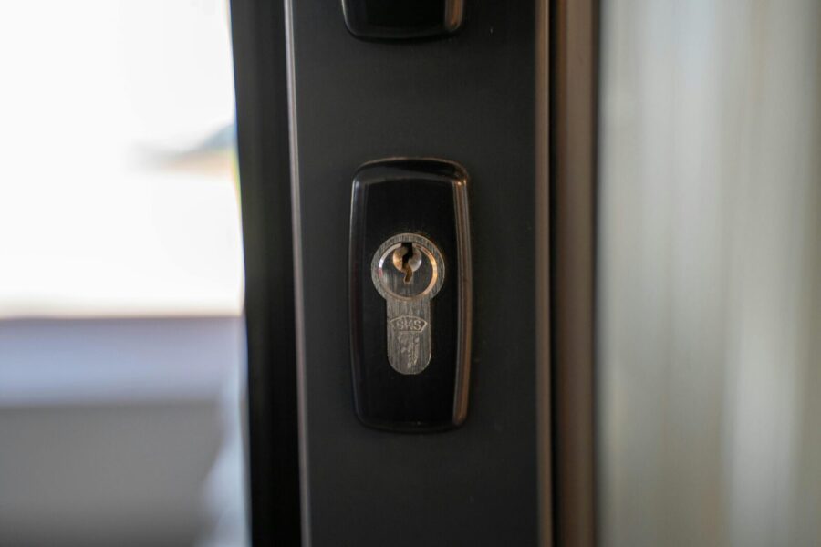 Detailed view of a steel keyhole on a door ensuring security and privacy.