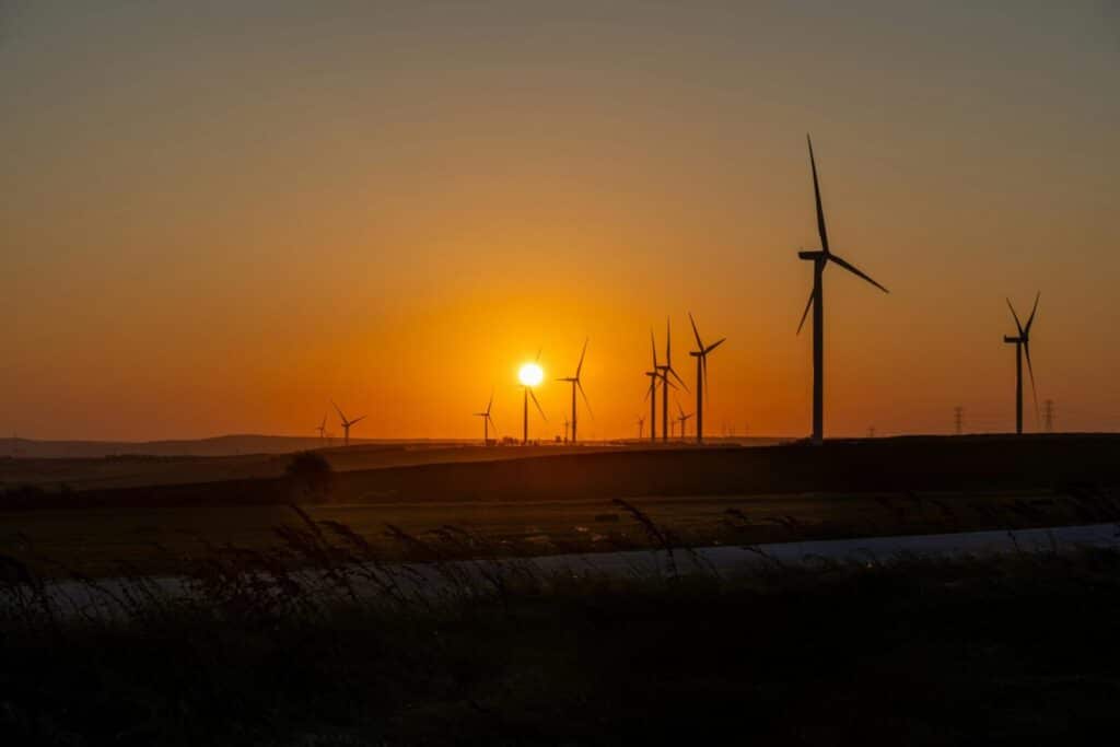Beautiful sunset over a wind farm in Silivri, İstanbul, showcasing sustainable energy efforts.