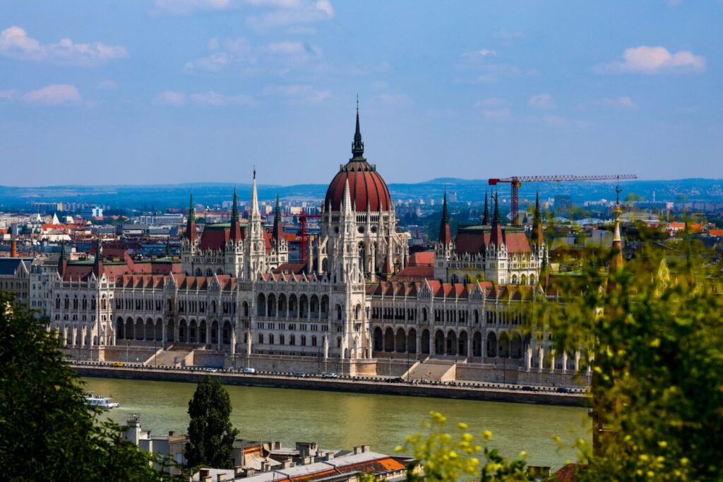 A breathtaking view of the iconic Hungarian Parliament Building on a sunny day in Budapest, Hungary.