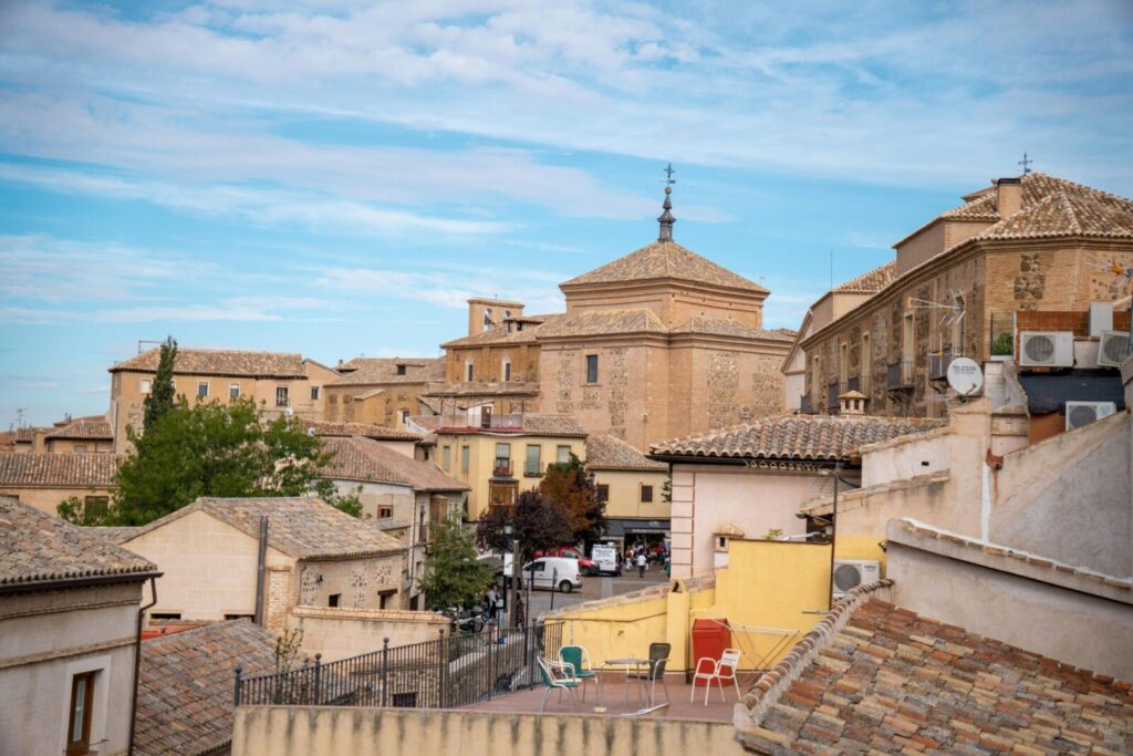 Scenic view of Toledo's historic architecture under a clear sky.