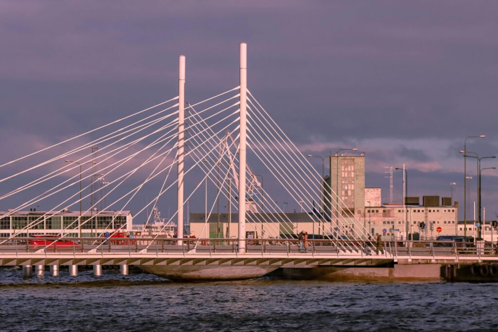 A stunning view of a modern cable-stayed bridge in Malmö, Sweden during sunset.
