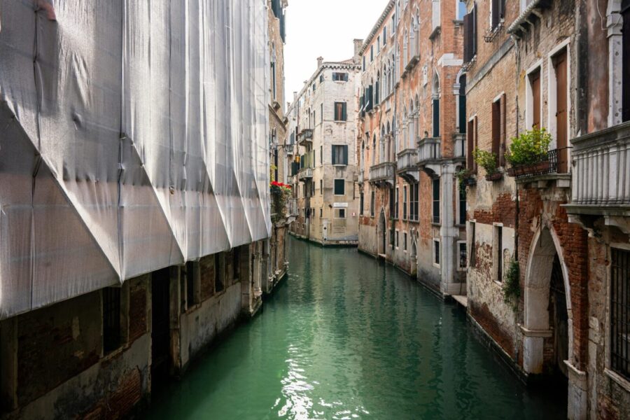 Explore the scenic charm of Venice's historic canals lined with classic architecture.