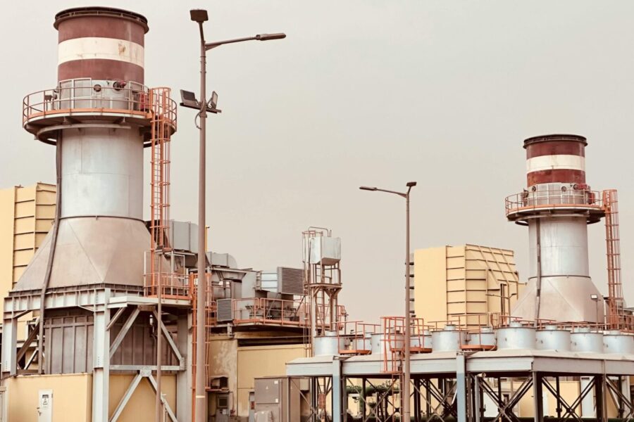 View of industrial power plant towers in Saudi Arabia, showcasing modern energy infrastructure.