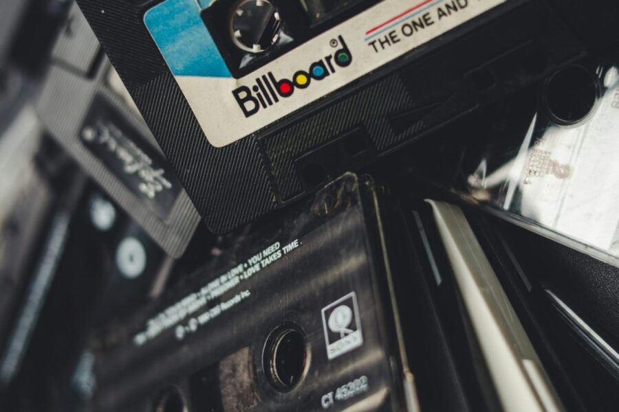 Close-up of a pile of vintage cassette tapes capturing a retro feel. Ideal for nostalgic themes.