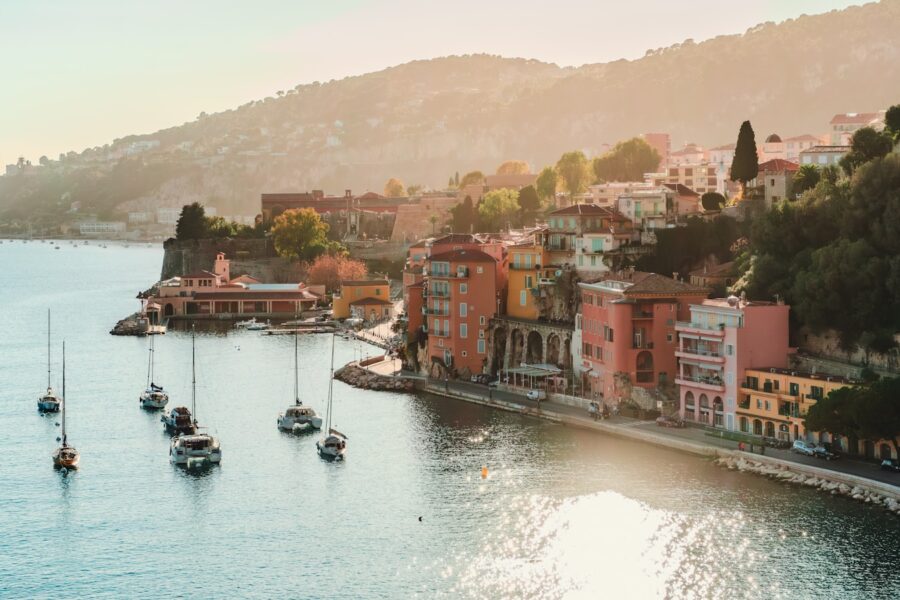 a group of boats floating on top of a body of water