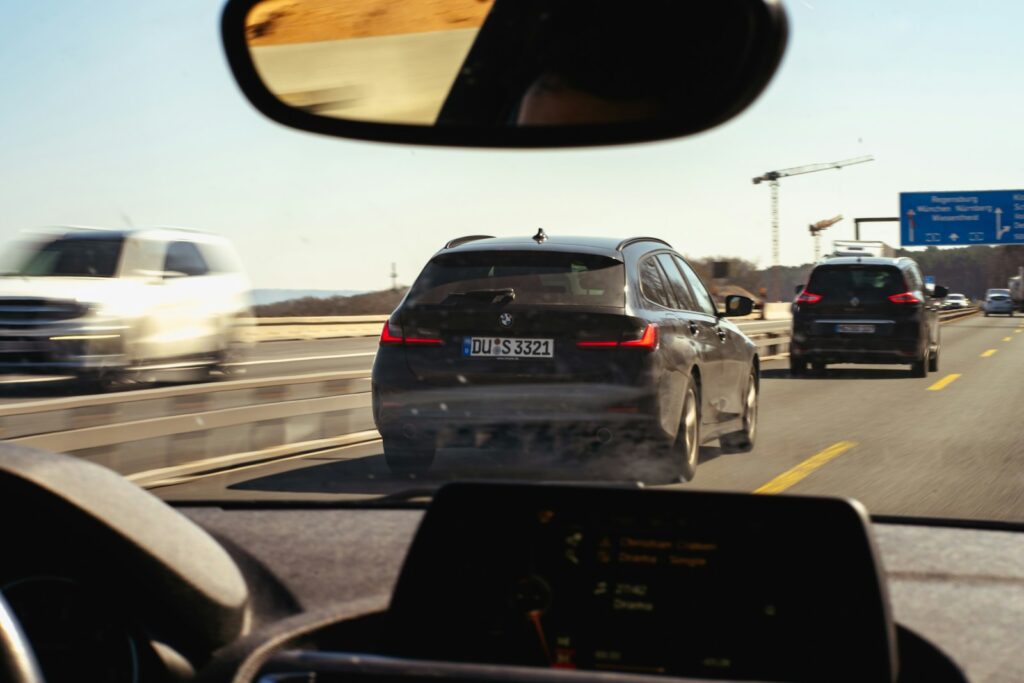 Driving on a busy highway with other cars.