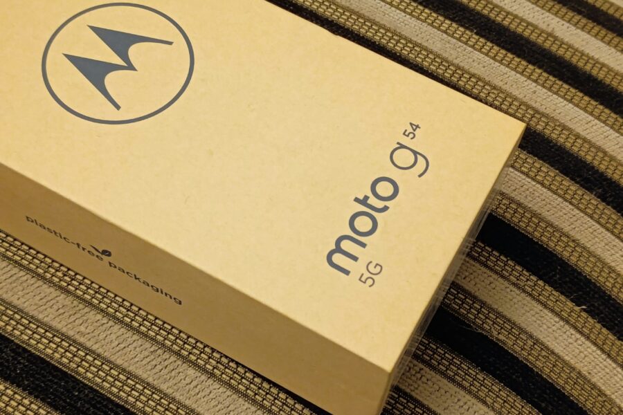 a cardboard box sitting on top of a bed