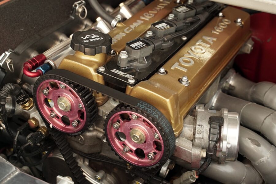 Close-up of a modified toyota engine with gold valve cover.