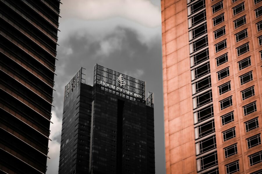 A black and white photo of two tall buildings