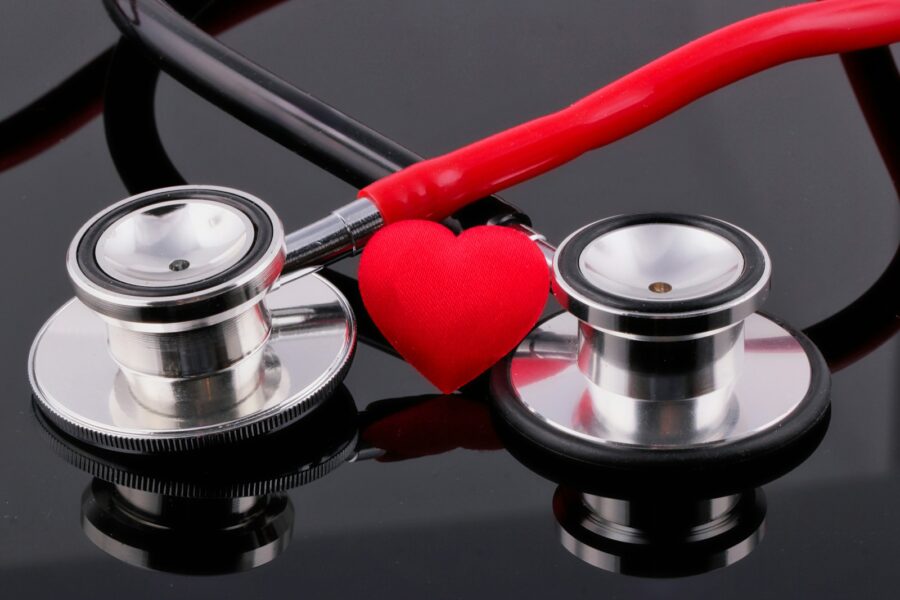 a stethoscope and a heart on a table
