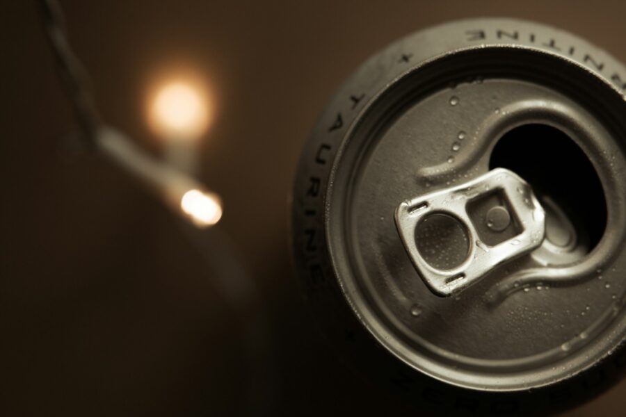 a can of soda sitting on top of a table