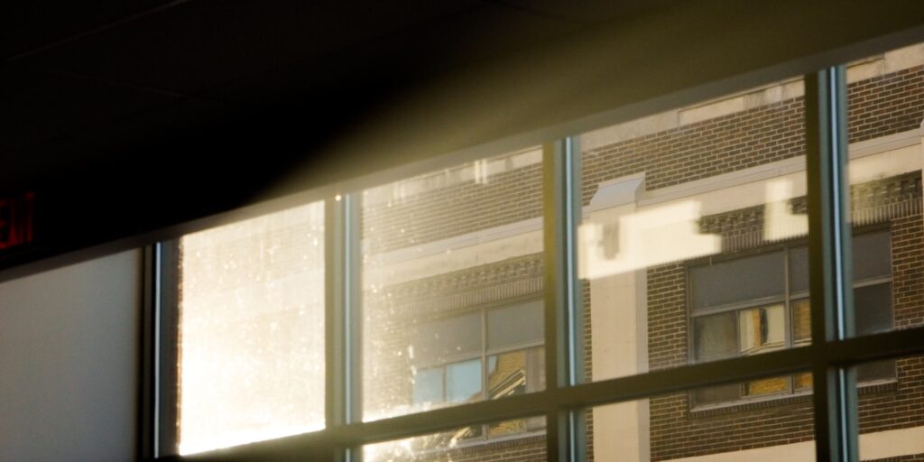 a view of a building through a window at night