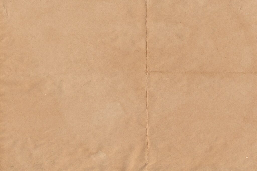a piece of brown paper with a white background
