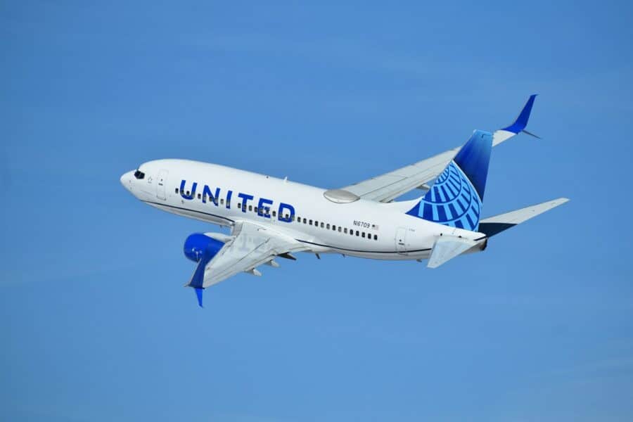 a united airlines plane flying in the sky