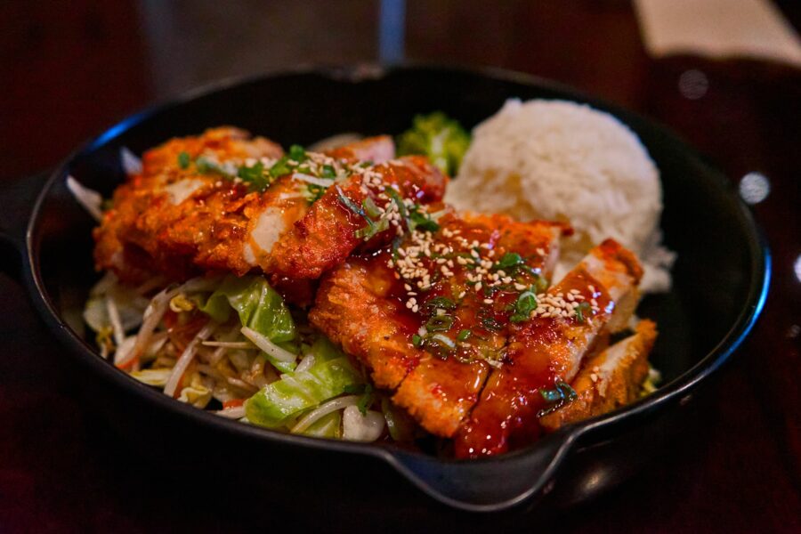 A delicious meal of grilled salmon with rice and vegetables