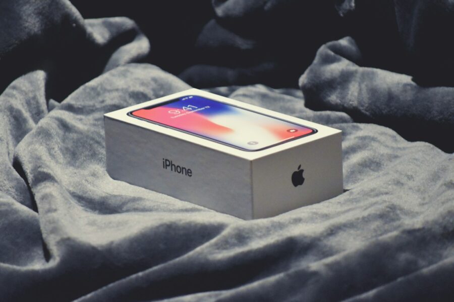 space gray iPhone X box on gray textile