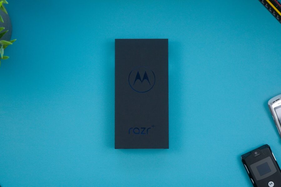 a motorola cell phone sitting on top of a blue table