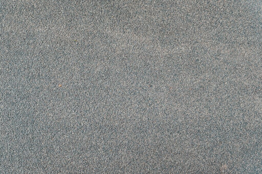 a red fire hydrant sitting on top of a sidewalk