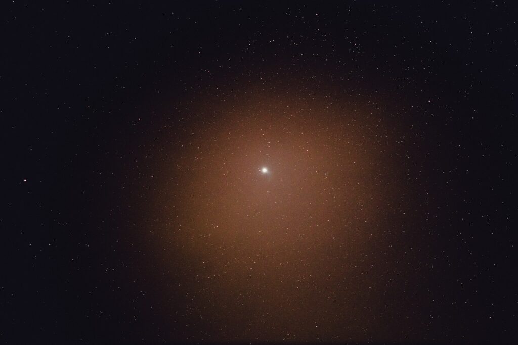 orange and yellow sun in dark sky