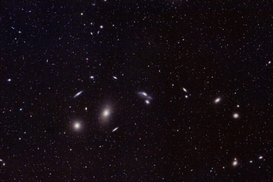 Captivating image of distant galaxies and star clusters in the vast universe. Perfect for astronomy enthusiasts.