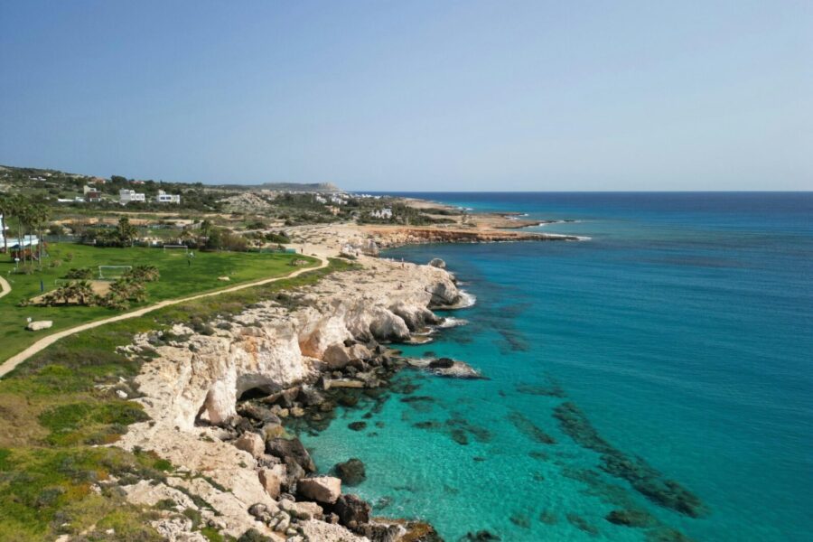 A breathtaking aerial view of Ayia Napa's rocky coastline and crystal-clear turquoise waters.