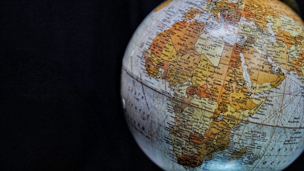 Close-up of a vintage globe highlighting Africa and the Middle East with intricate geography details.
