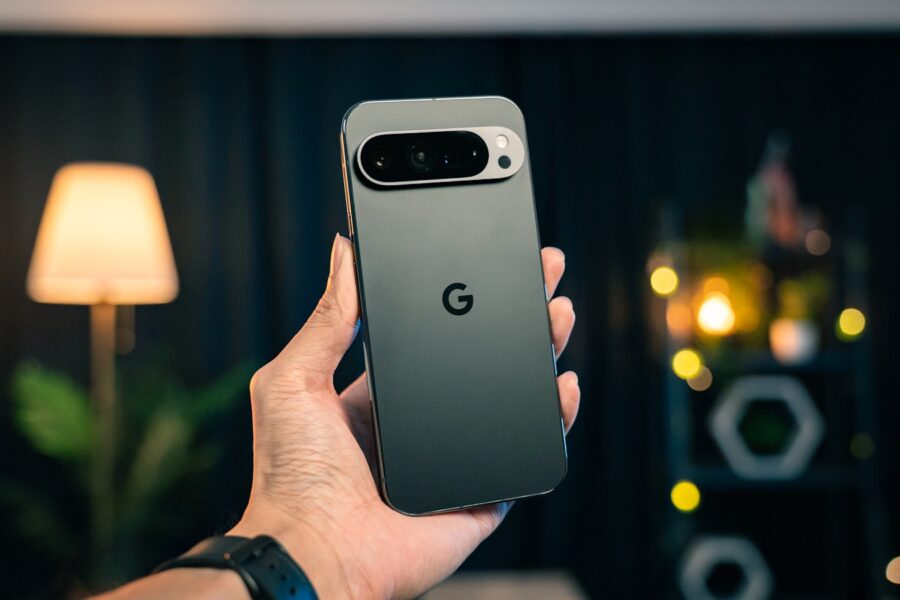 A person holding a cell phone in their hand